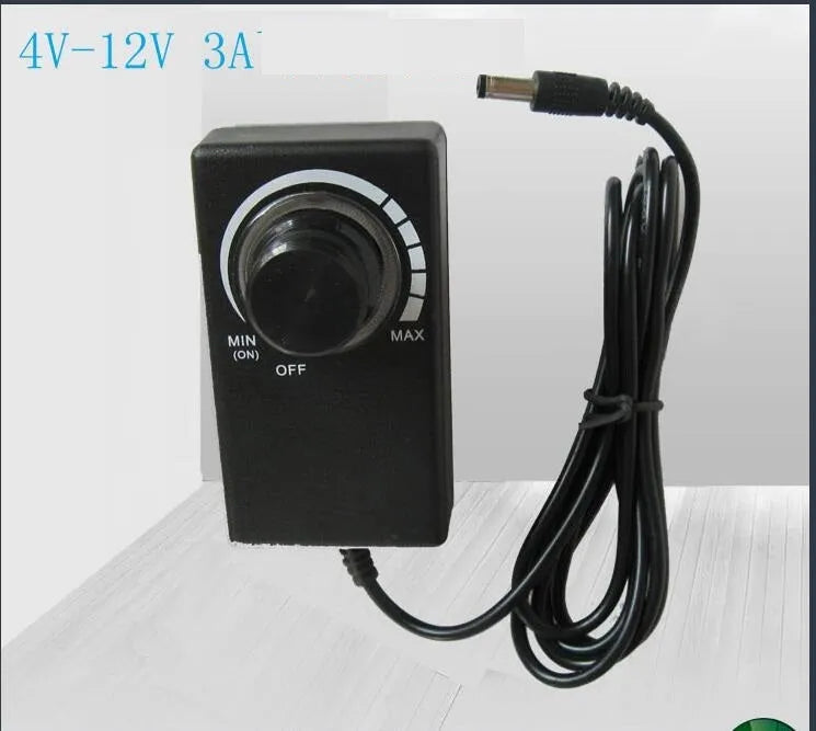 Compact black adjustable power adapter with LED digital display showing voltage output on a white background