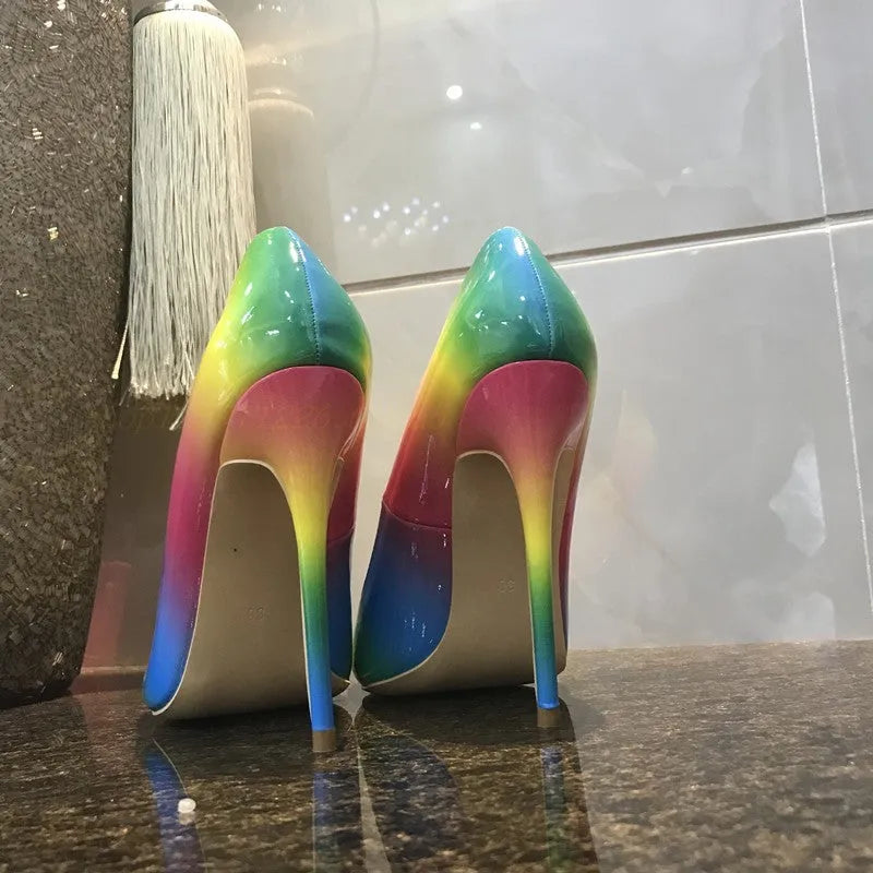 Rainbow glossy patent leather women's ultra-high heel shoe with pointed toe and thin heel.