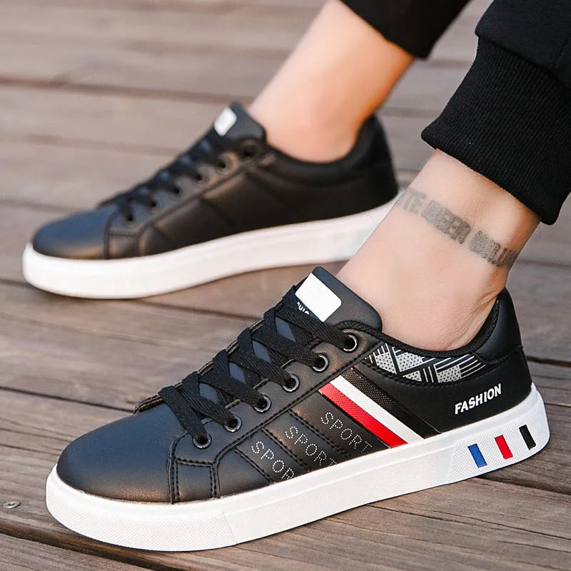 A pair of black sports shoes displayed on a white background, showing the side profile and sole.
