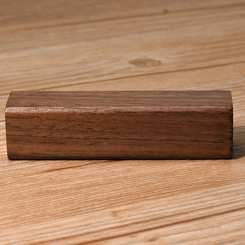 Brown walnut wood portable power bank with 2000mAh capacity and gift box packaging.