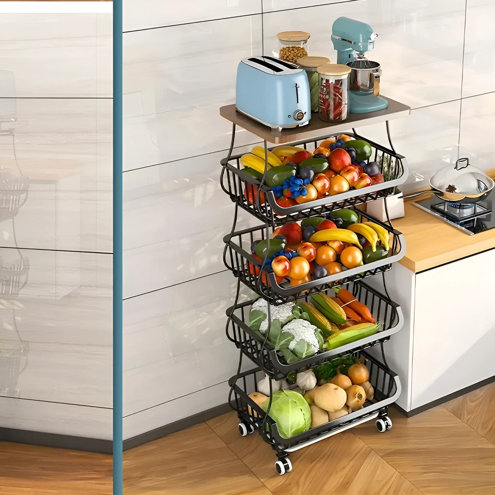 Black six-tier metal kitchen storage trolley with wheels on a wooden floor.