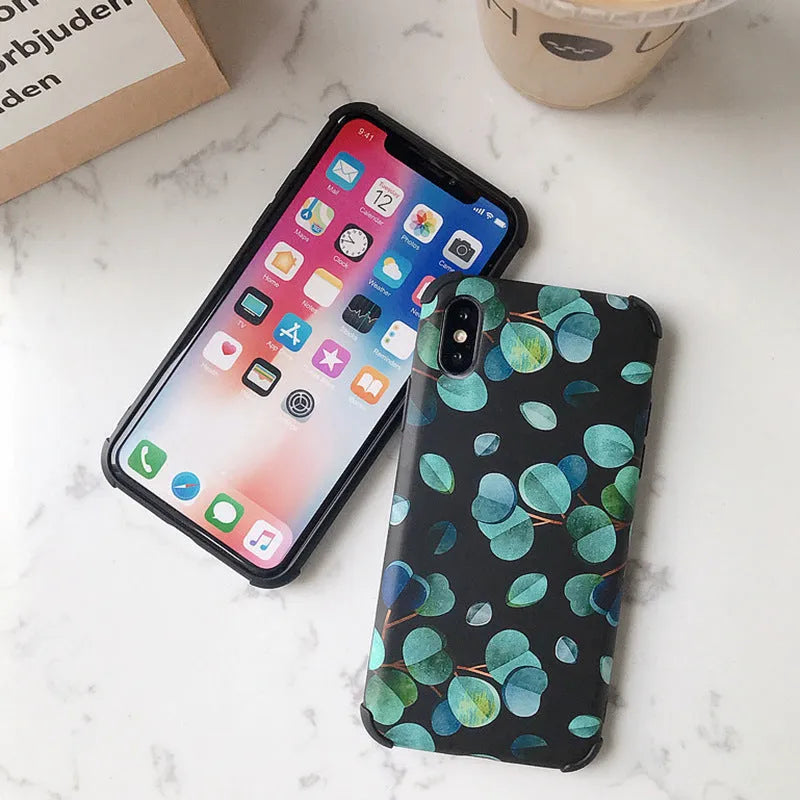 Black silicone iPhone case with leaf pattern design showing front and back views