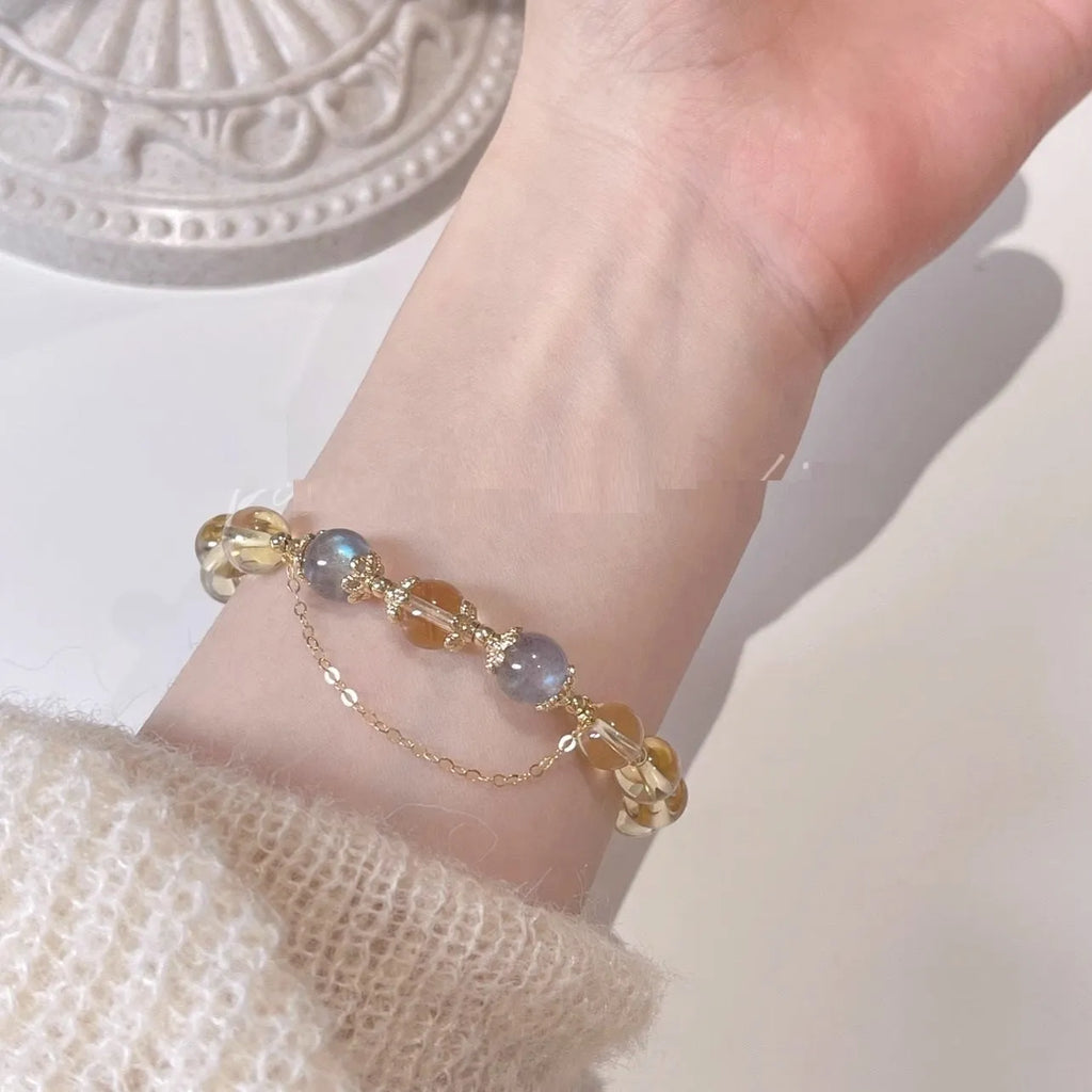 Moonstone crystal bracelet with 14K gold electroplating and diamond-shaped citrine beads on adjustable band