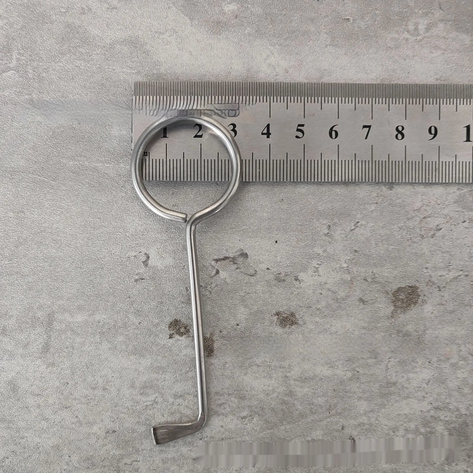 Two silver alloy universal wrench tools side by side on a surface.