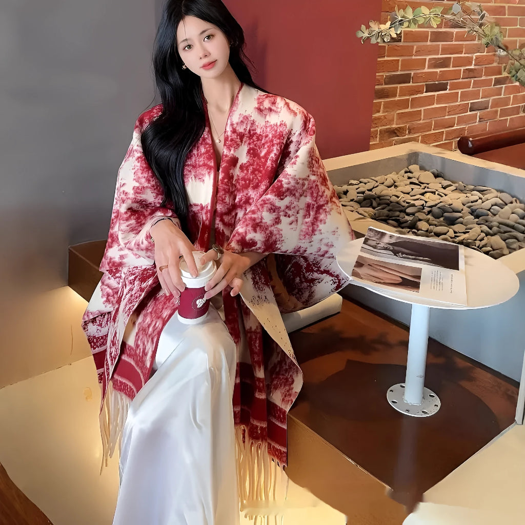 Women's polyester tassel scarf cape in a shawl style, shown in available colours.
