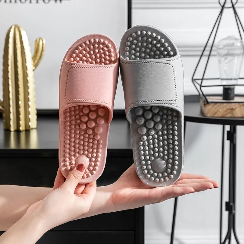 Pair of non-slip PVC massage slippers with breathable upper and wear-resistant injection-moulded sole, available in seven colours.