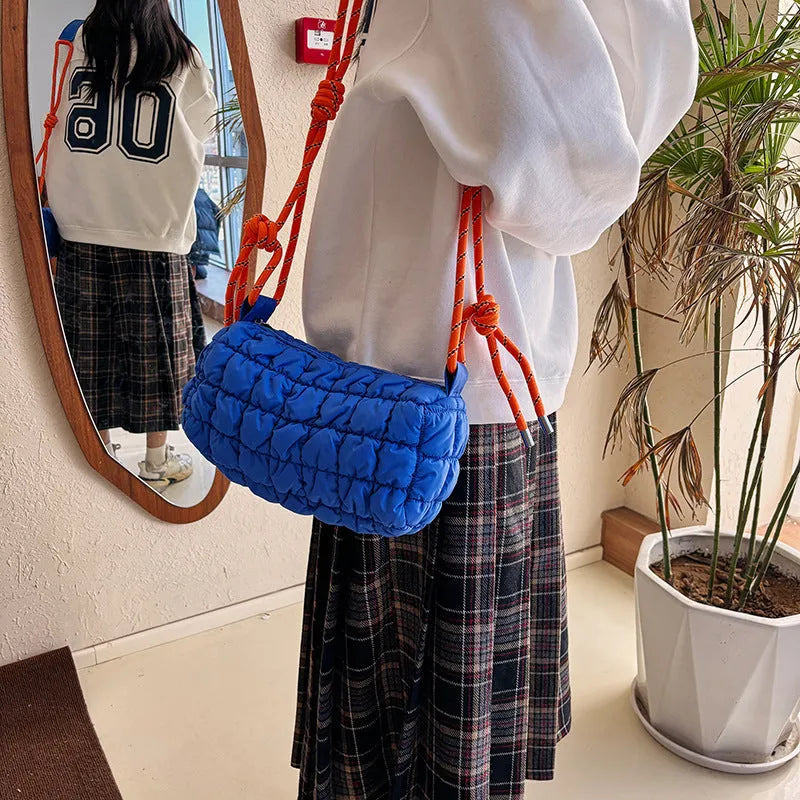 Women's lightweight nylon messenger bag in pillow shape with rhombus detailing and single shoulder strap