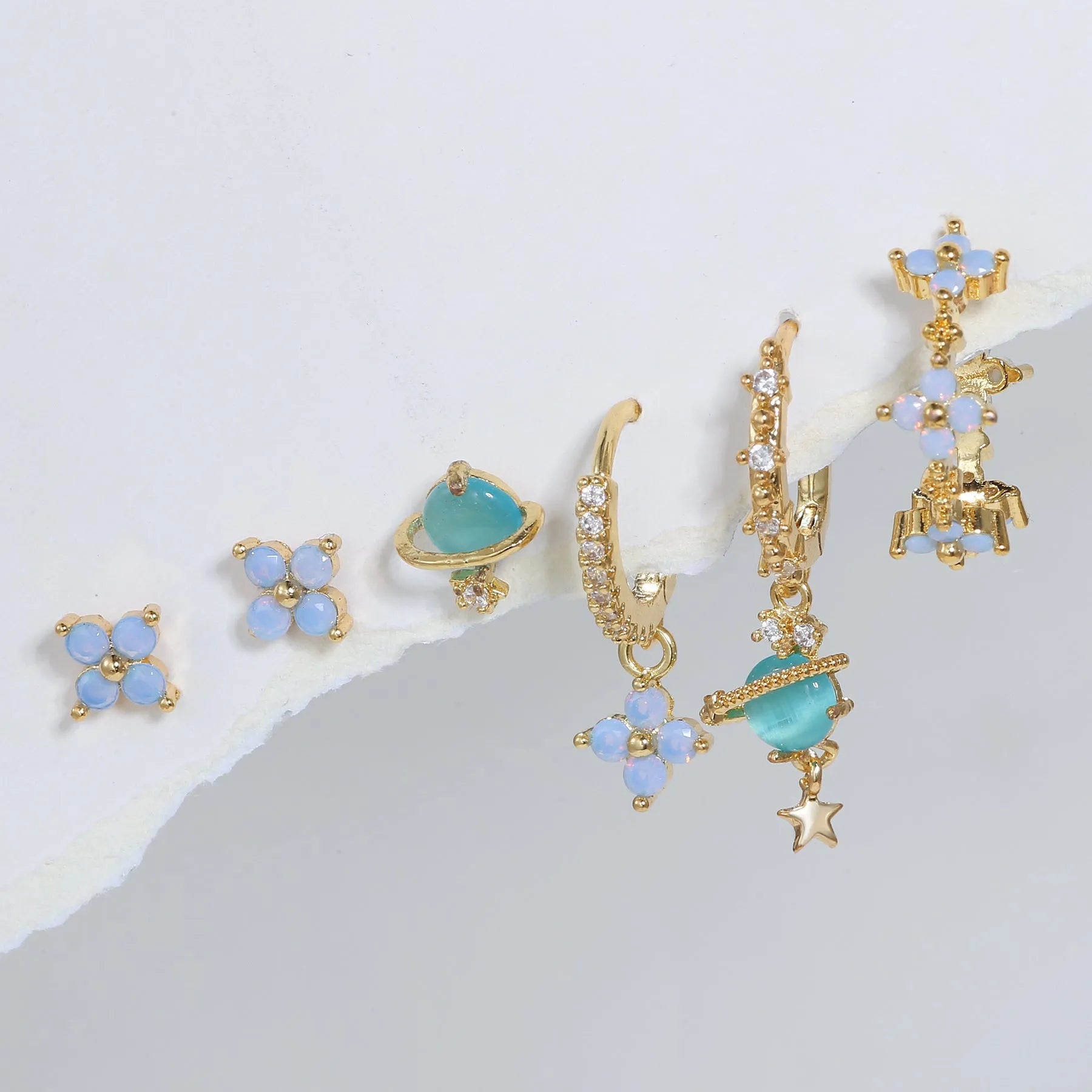 Gold and silver flower stud earrings with zircon detail in Japanese Korean sweet girl style.