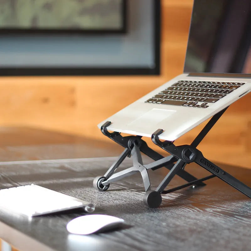 Black reinforced nylon folding laptop stand shown in a folded position with dimensions.