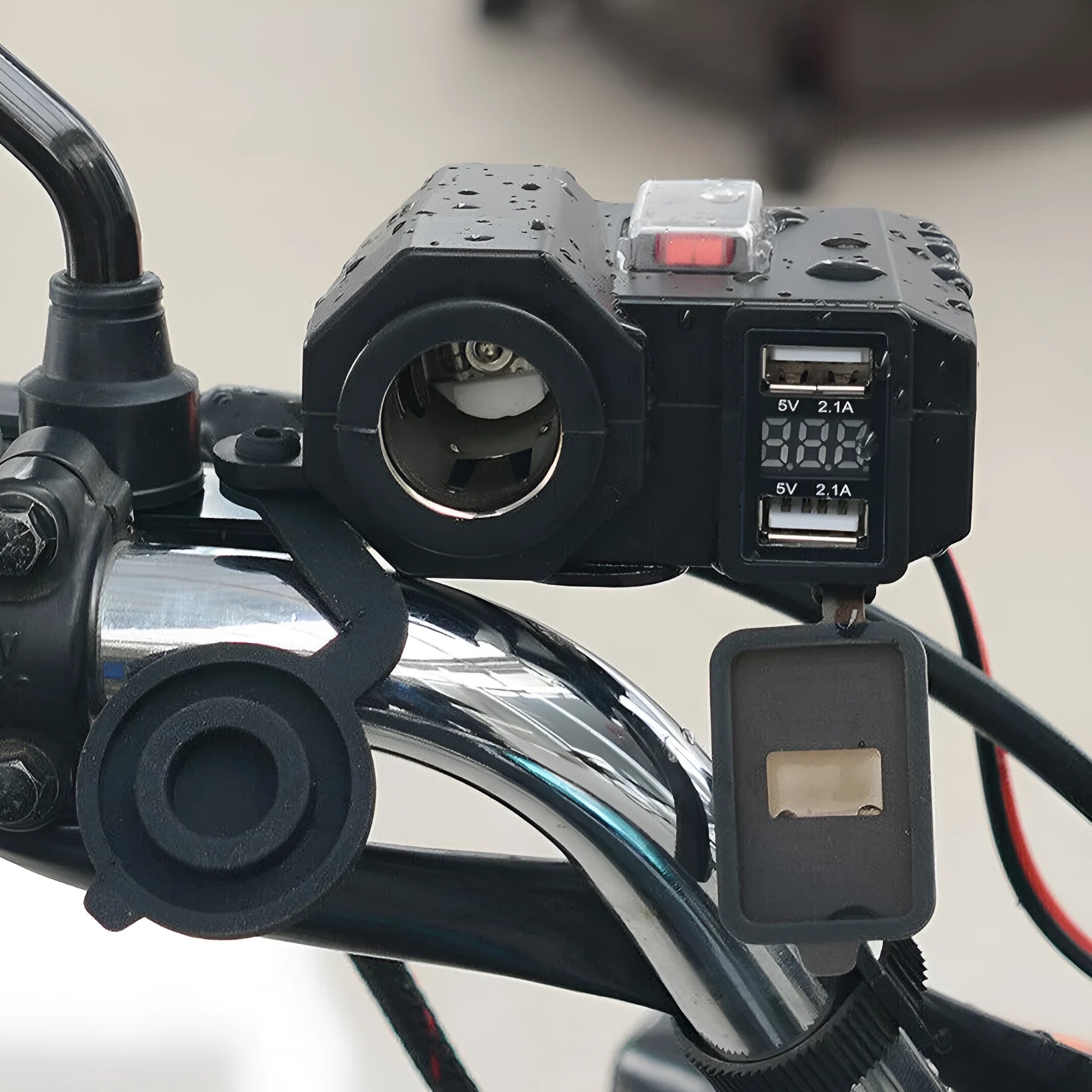 Black dual USB waterproof motorcycle charger with voltmeter and cigarette lighter mounted on handlebar