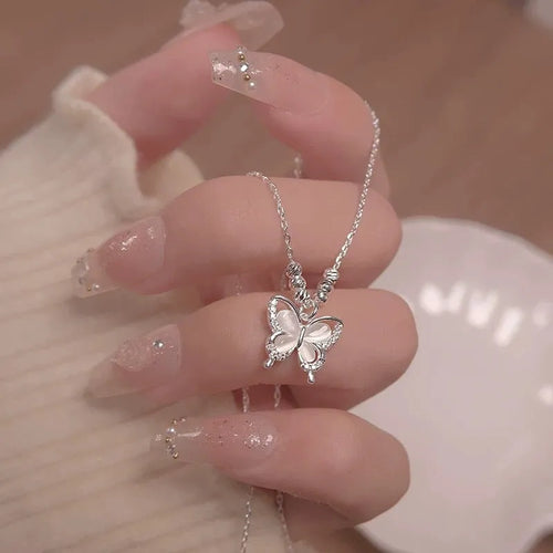 925 sterling silver opal butterfly pendant necklace on a silver adjustable cross chain.