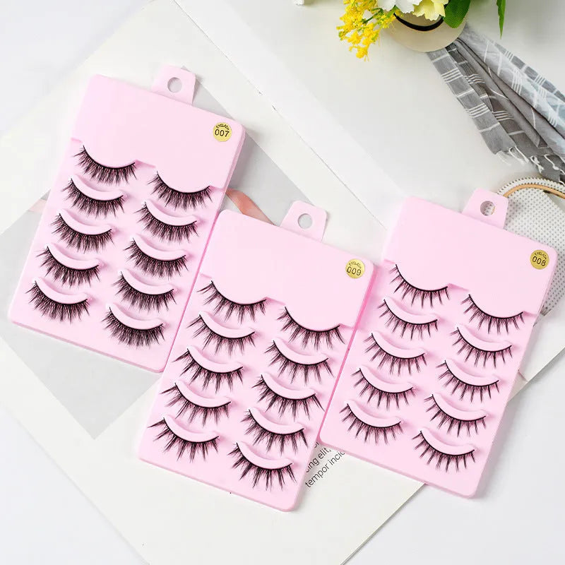 Pack of manga style false eyelashes showing natural wispy designs on plastic black terriers for cosplay and Korean makeup.
