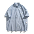 Blue striped short-sleeved overalls shirt in a loose cardigan style for casual wear.