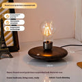 Black iron art suspension bulb night lamp on a wood grain base for desktop decoration.
