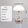 Light luxury mushroom table lamp in transparent colour option on a bedroom desk with USB cable connected.