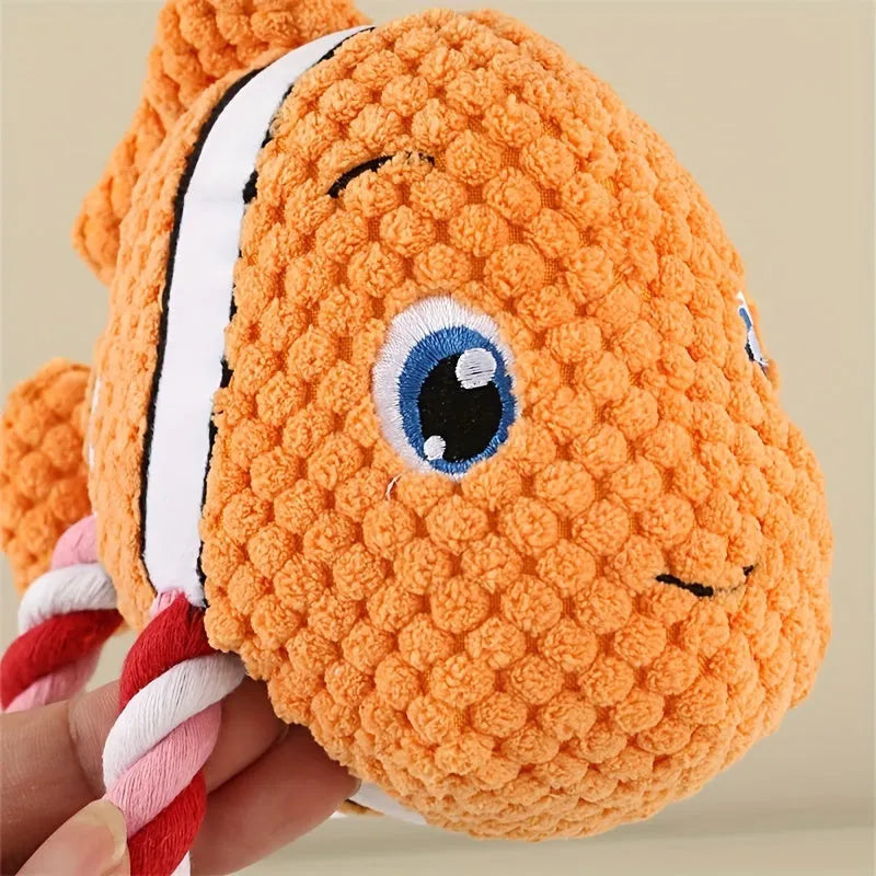 Grey turtle-shaped stuffed dog toy with internal knotted rope for chewing