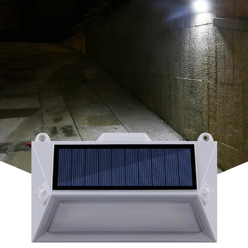 Solar outdoor human body induction guide step light mounted on a wooden fence, 160x95x36mm ABS+PC housing