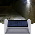 Solar outdoor human body induction guide step light mounted on a wooden fence, 160x95x36mm ABS+PC housing
