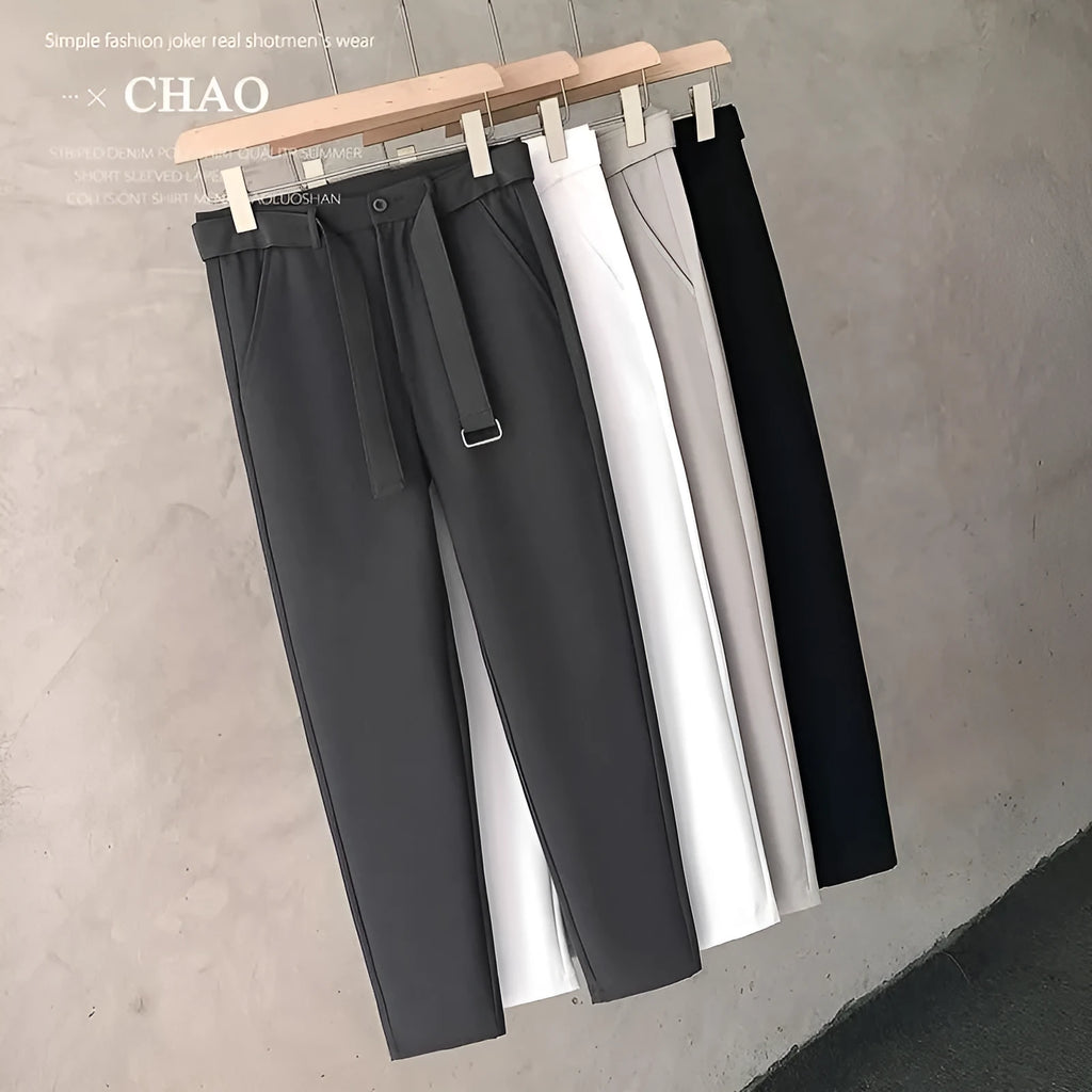 Boy wearing slim straight tapered wool trousers in grey for a business casual outfit.