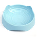 Ceramic dog slow feeder puzzle bowl in blue with non-slip base, shown in S and L sizes.