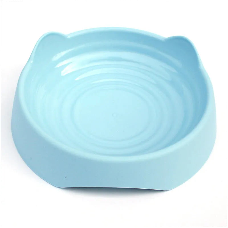 Ceramic dog slow feeder puzzle bowl in blue with non-slip base, shown in S and L sizes.