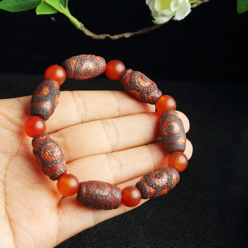 Distressed agate Tibet beads bracelet with three eye dzi design and polished stone beads