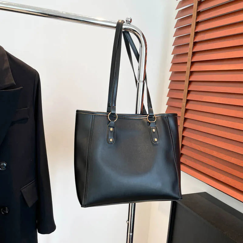 Korean style black PU shoulder underarm bag with a sandwich pocket and horizontal square shape.