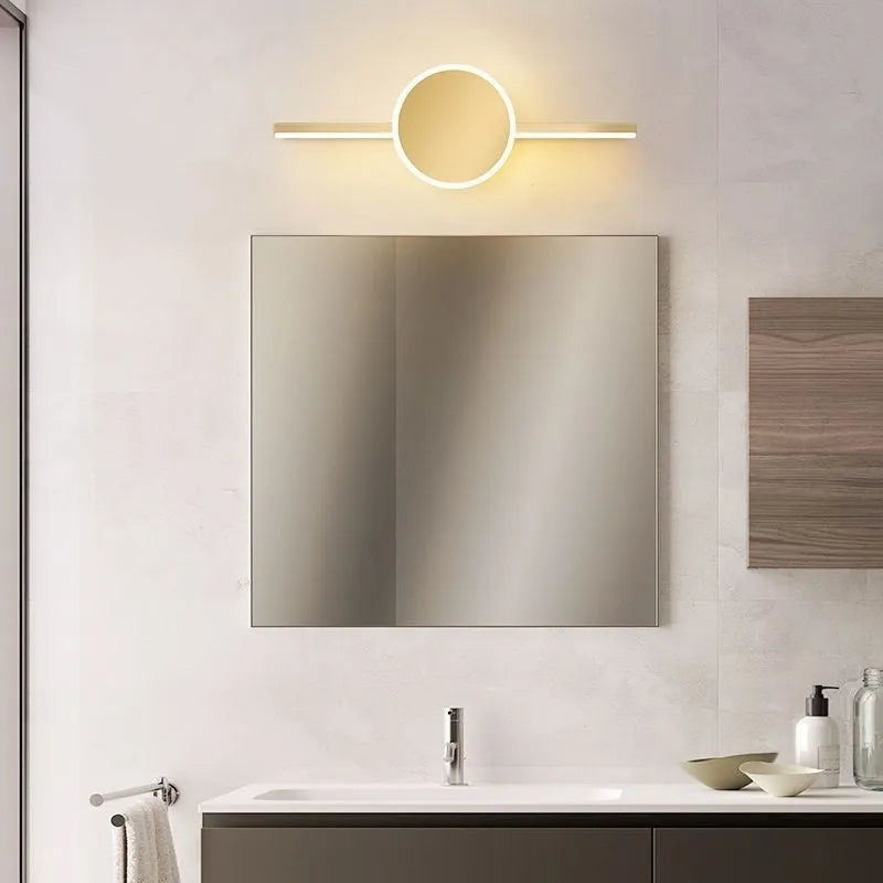 Gold-framed rectangular bathroom mirror cabinet with integrated LED light strip around the edge.
