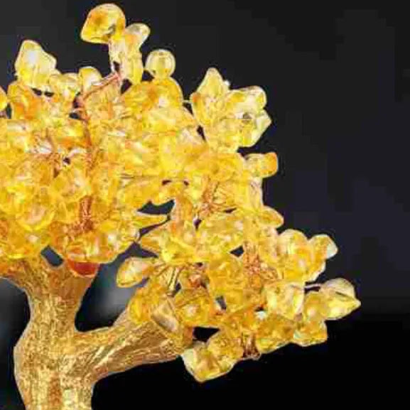 Citrine-coloured resin Feng Shui ornament of a water turtle with a money tree.