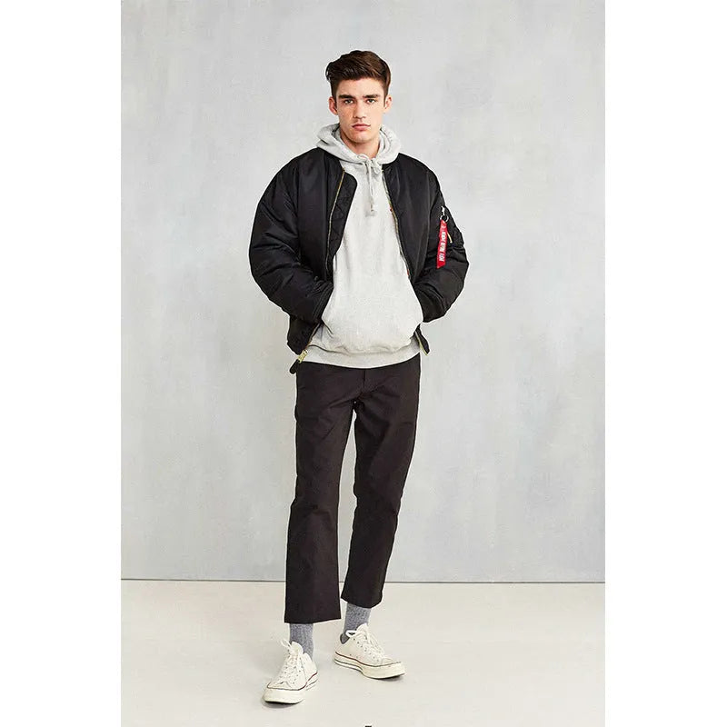 Men's loose fit army green cotton-padded pilot jacket on a hanger.