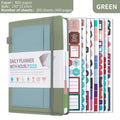 Undated A5 notebook with strap closure in purple PU cover, lying open on flat surface