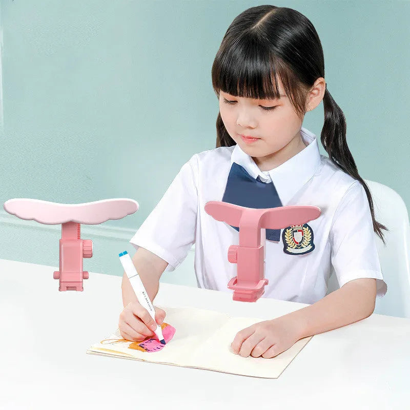 Student anti-myopia seated posture orthosis in blue silicone and ABS on a desk