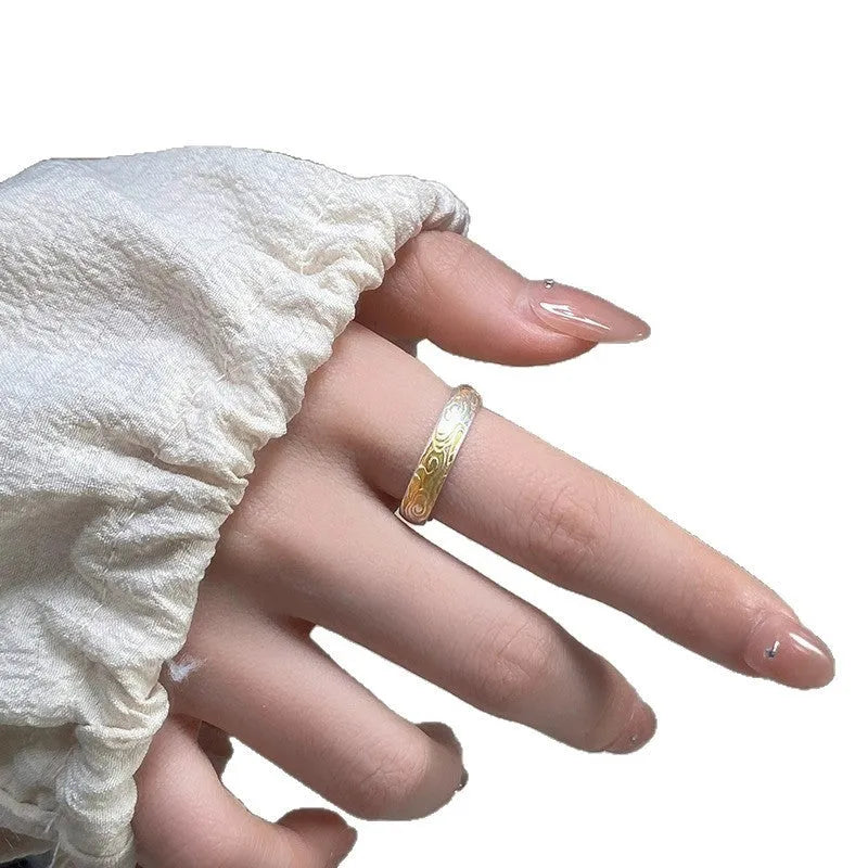 Open-mouth geometric white copper ring with Xiangyun pattern in silver-gold electroplate.