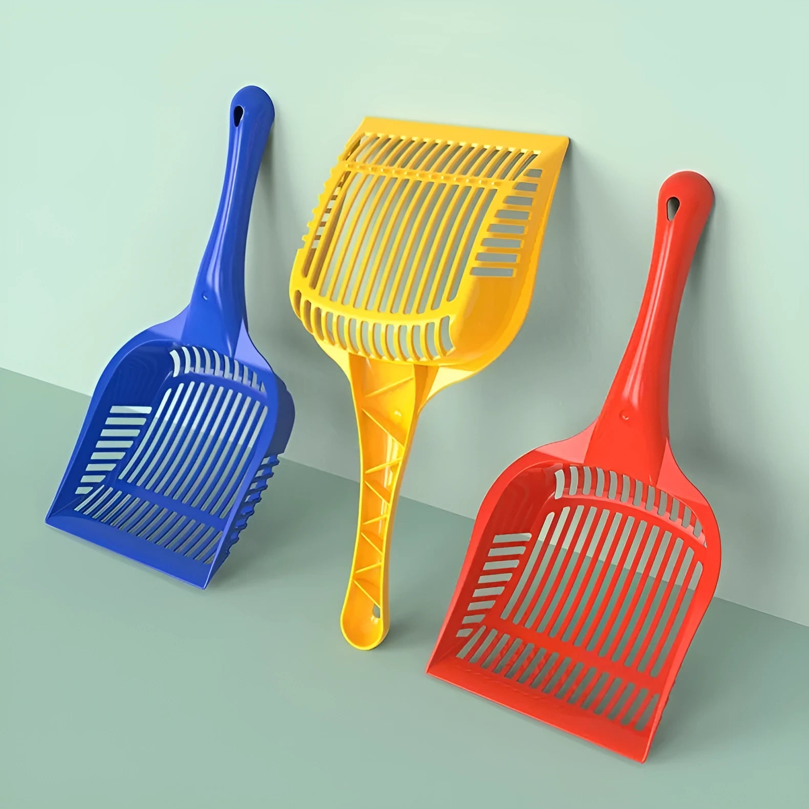 PP plastic cat litter scoop in red, yellow and blue colours showing small and medium size options