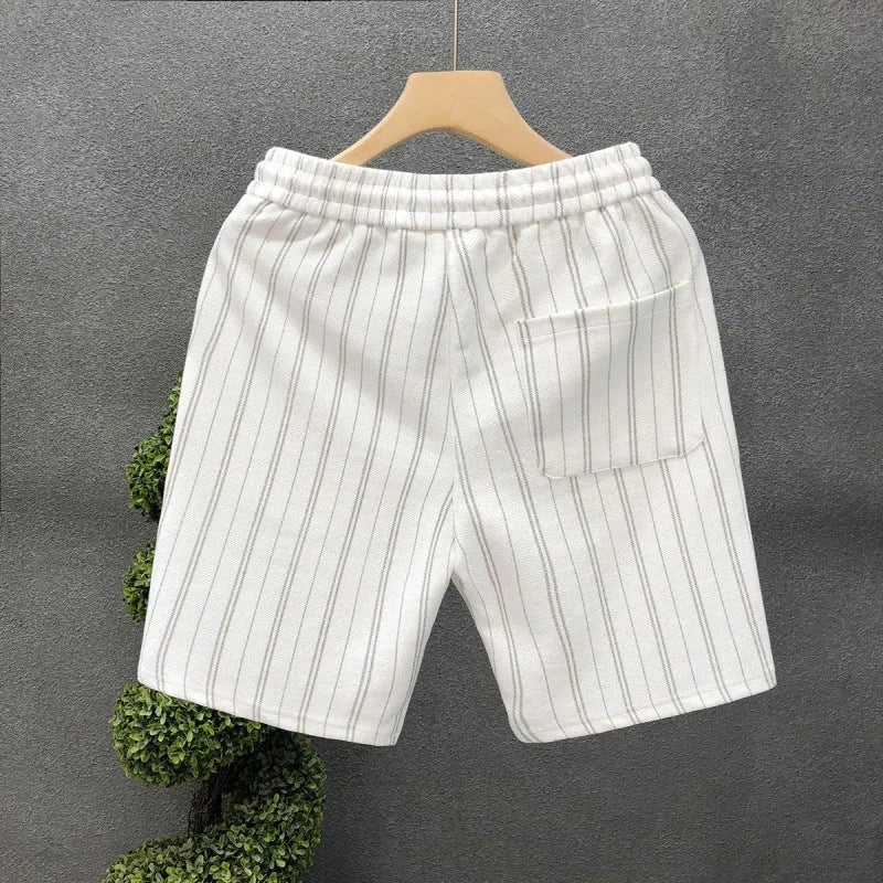 Men's black and white striped casual shorts with fleece lining and elastic waistband shown in straight cut design