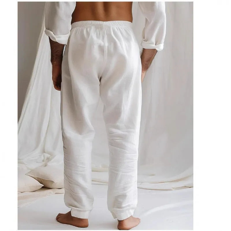 Men's light grey loose-fit cotton linen summer trousers with an elastic drawstring waist and straight legs.