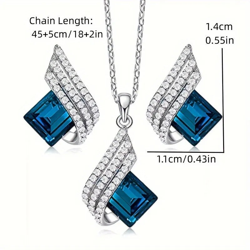 Alloy pendant necklace and matching earrings with glass ornamentation and cross chain design
