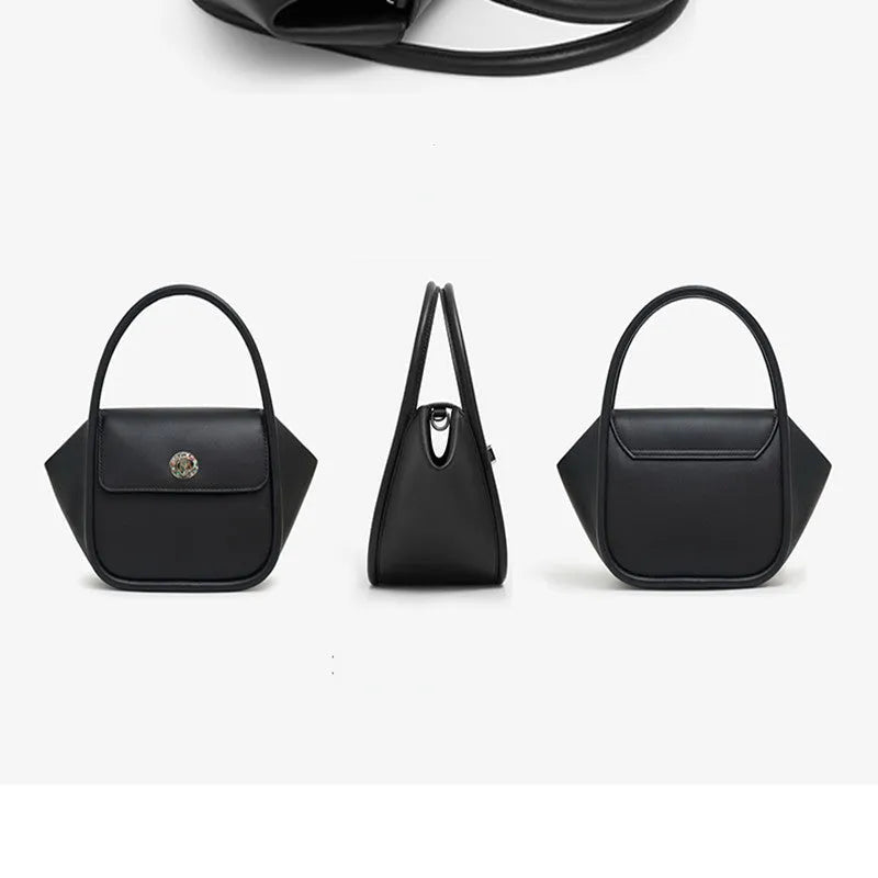 A women's cow leather wing-shaped handbag with a latch closure and a single shoulder strap.