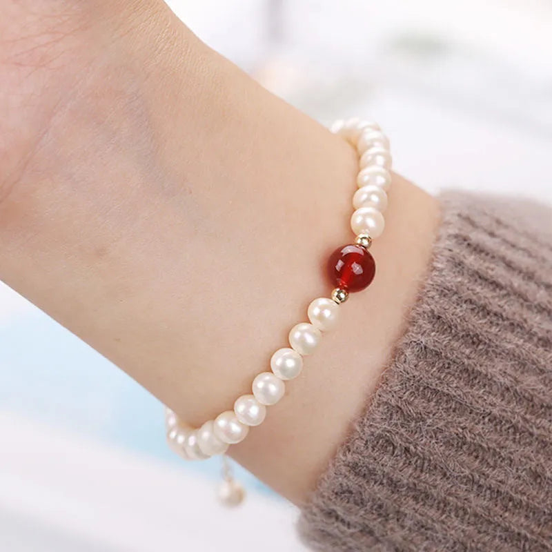Chinese style glass bead bracelet with bamboo leaf design and manual craftsmanship details.