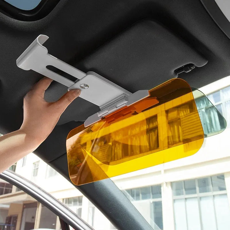 Car sun visor with anti-high beam goggles showing telescopic extension mechanism