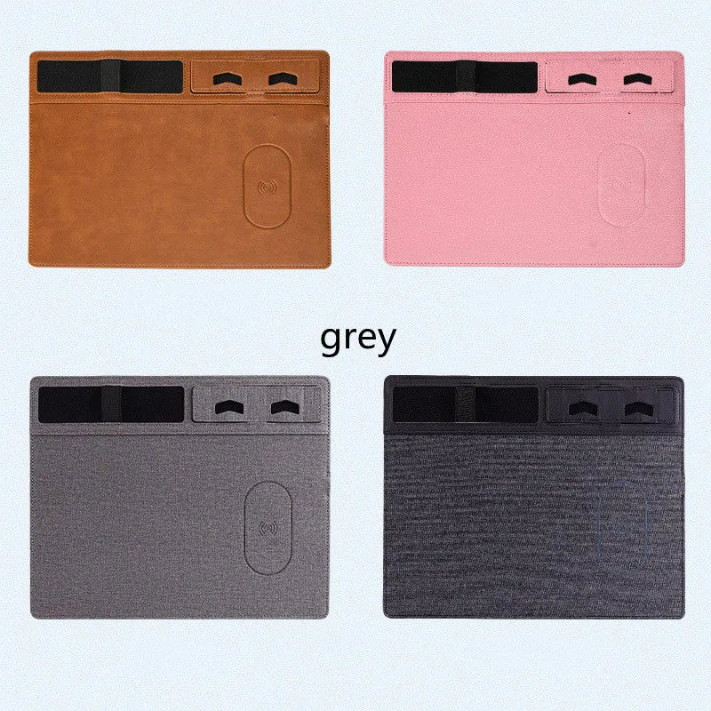 Pink wireless charging mouse pad with phone holder on a desk, showing USB cable and 320mm x 260mm size.