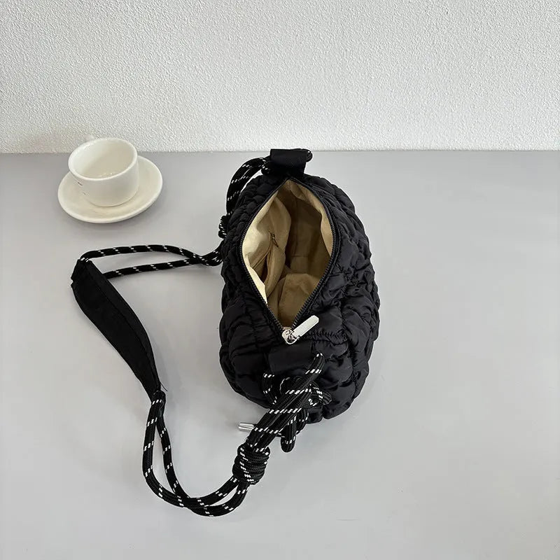 Women's lightweight nylon messenger bag in pillow shape with rhombus detailing and single shoulder strap