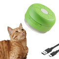 Green and yellow rechargeable silicone steam brush for cat and dog grooming on a white background