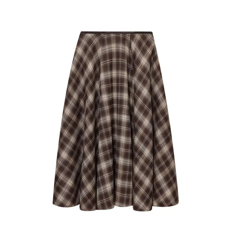 Women's loose plaid midi dress in brown with high-waisted half-skirt and check pattern on a white background