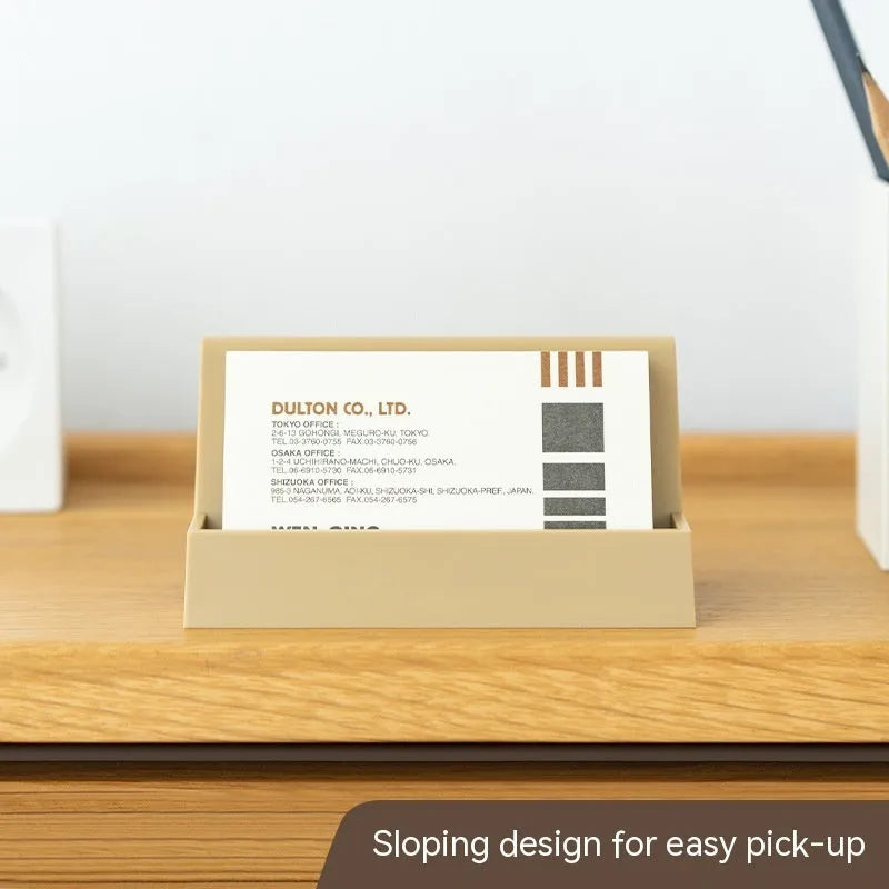 Geometric PS plastic business card stand with 20 slots in brown on a desk