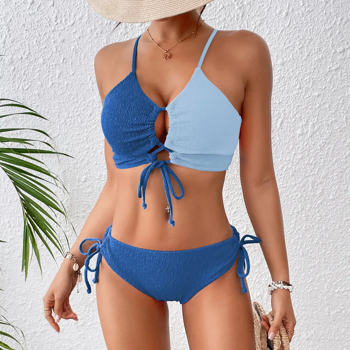 Women's black and white contrast colour cross sling hollow bikini set in polyester, front view