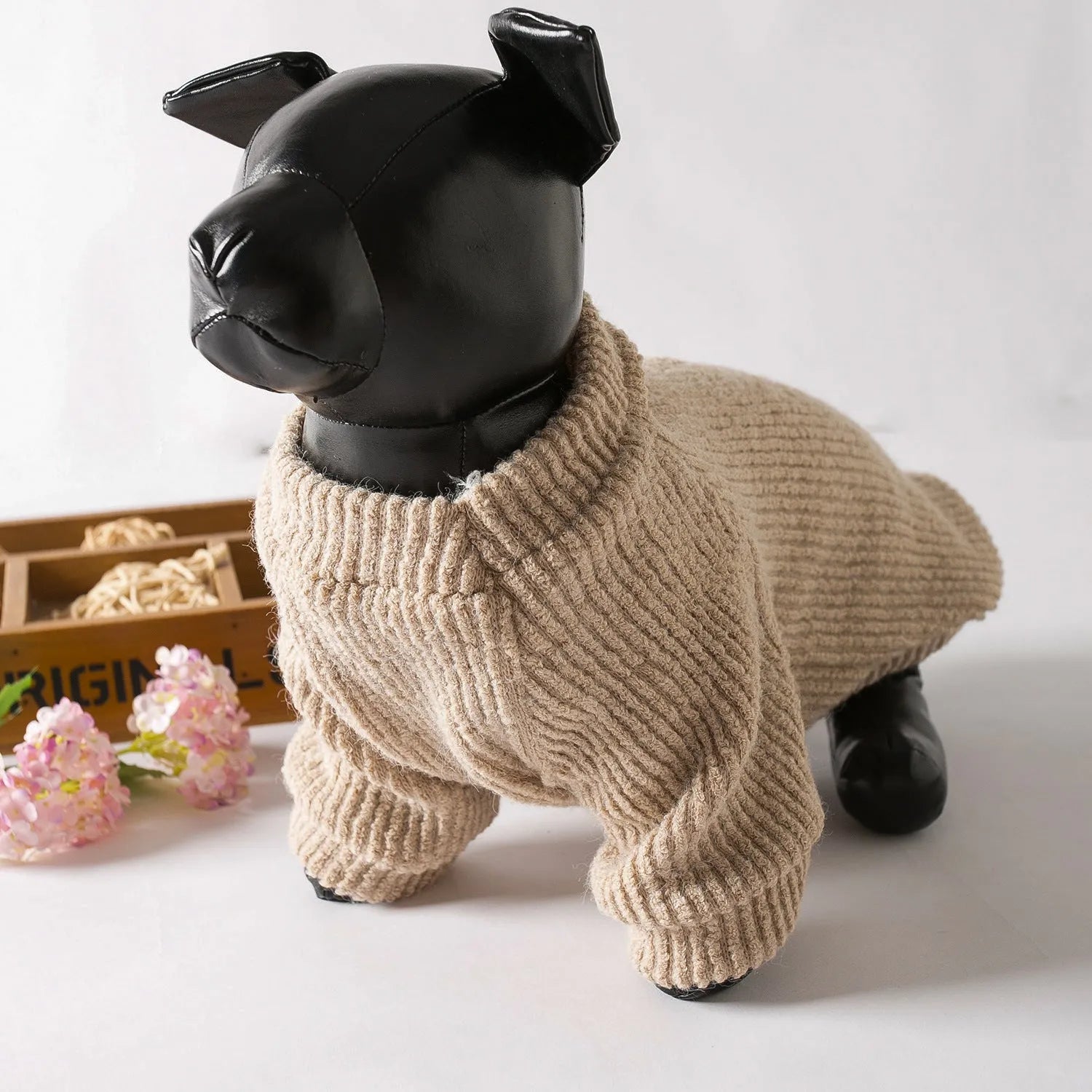 A brown cloth pullover sweater for a small dog on a white background.