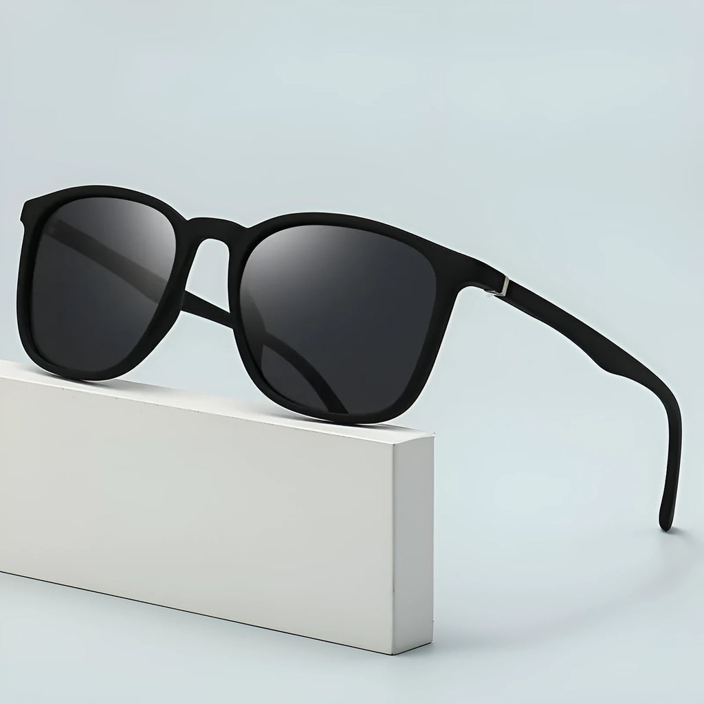 Men's polarised sunglasses with a PC frame and elastic paint surface, showing UV400 protection.