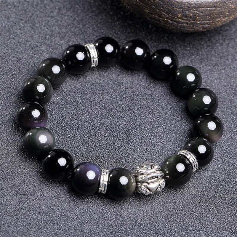Obsidian bracelet with natural cloud pattern and silver clasp shown in male 12mm and female 10mm sizes.