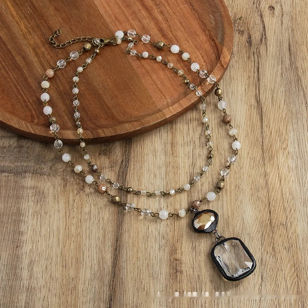 Adjustable tribal necklace with glass and stone pendant on two-layer chain in beige colour